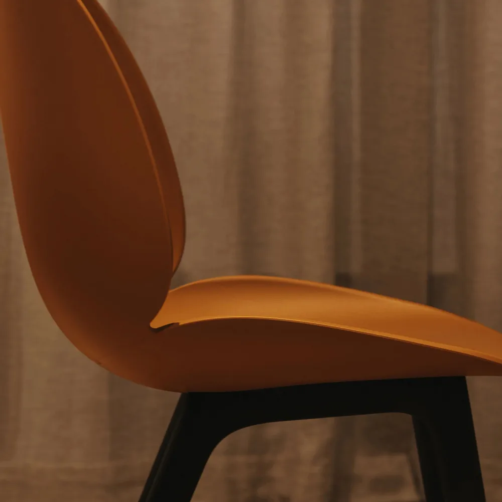 Beetle Plastic chair, Amber brown, black leg GUBI