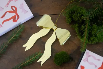 Bow decoration hanger - Gold - Pluto Design