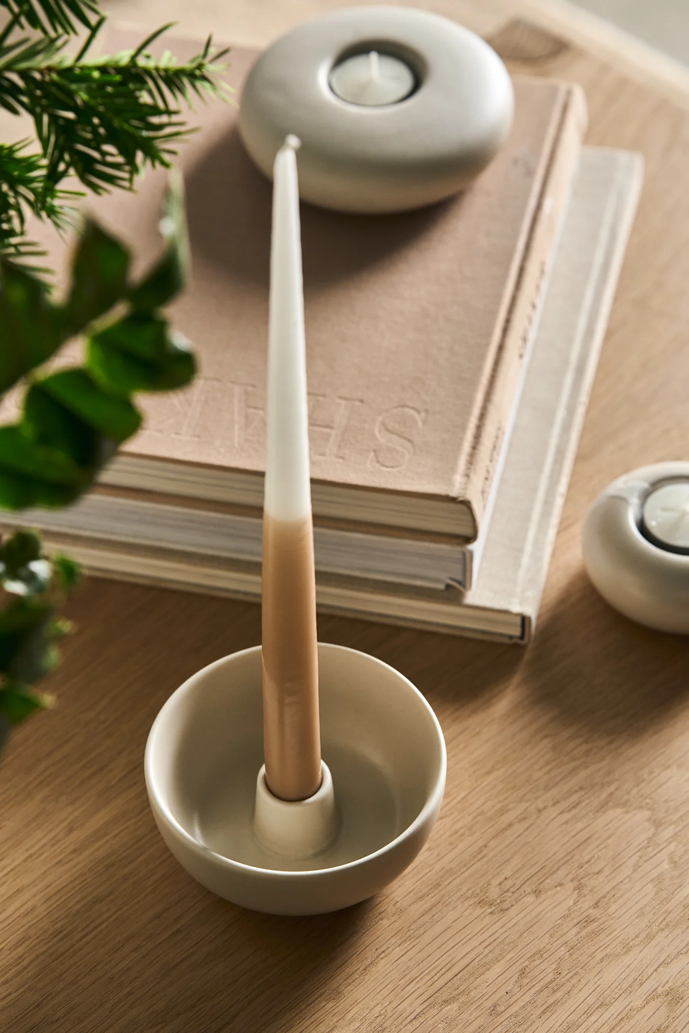The valley candle holder from Scandi Living is a great example of minimalist Christmas decor. Seen here with some books and small tealight holders. 