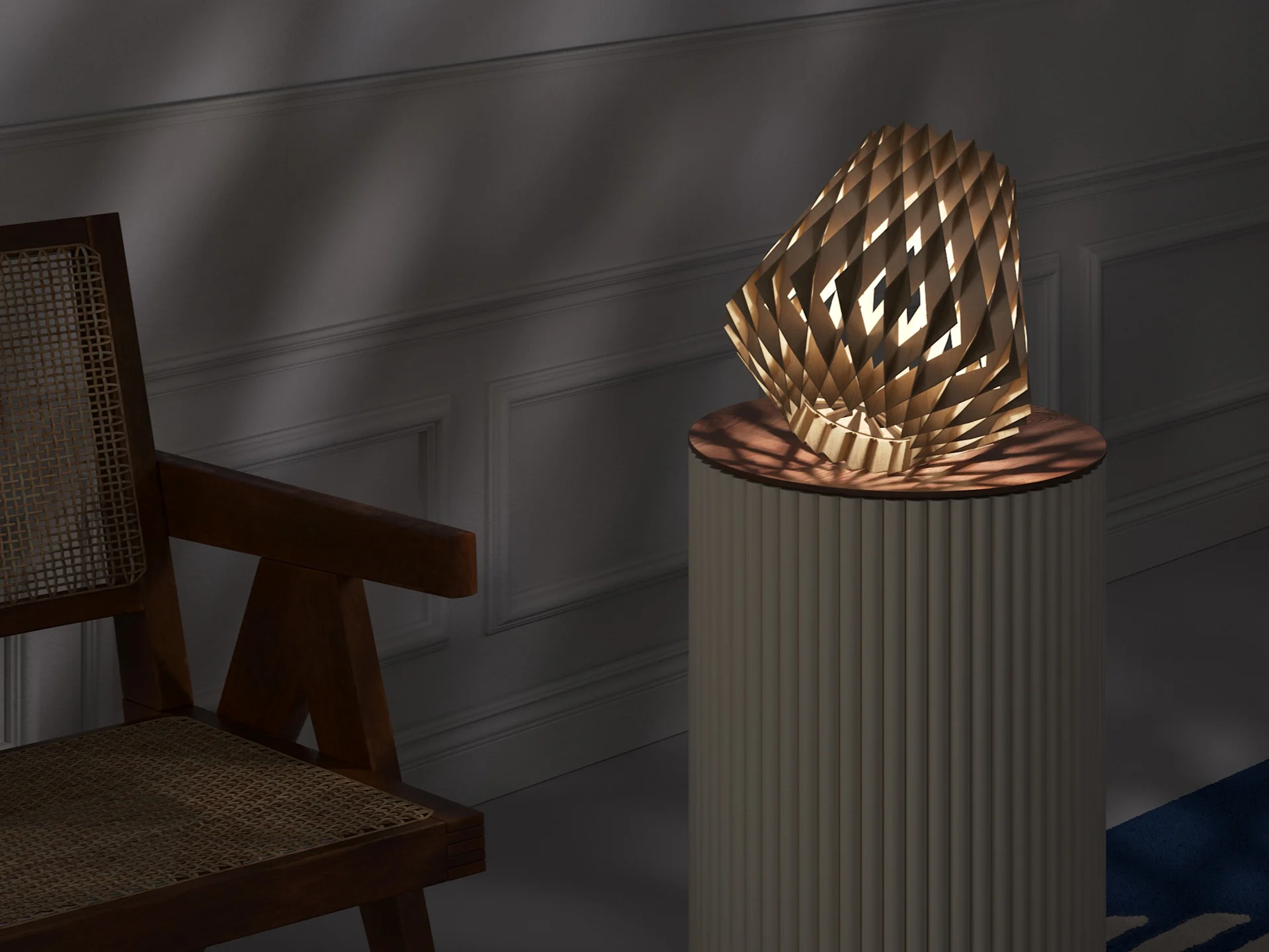 Geometric wooden lamp on a fluted pedestal, casting light and shadows in a room with a rattan chair.