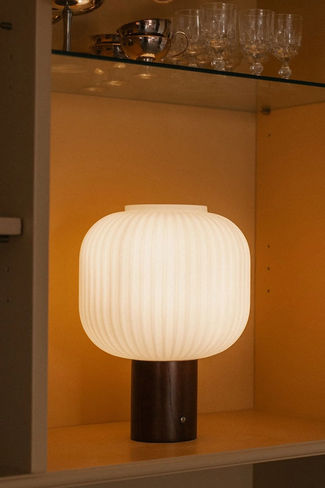 Choose the right light bulb - a young boy holds a glowing mushroom shaped lamp.